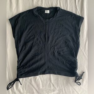Black cropped sleeveless top with ruched sides. Wilfred - Aritzia. Size medium.